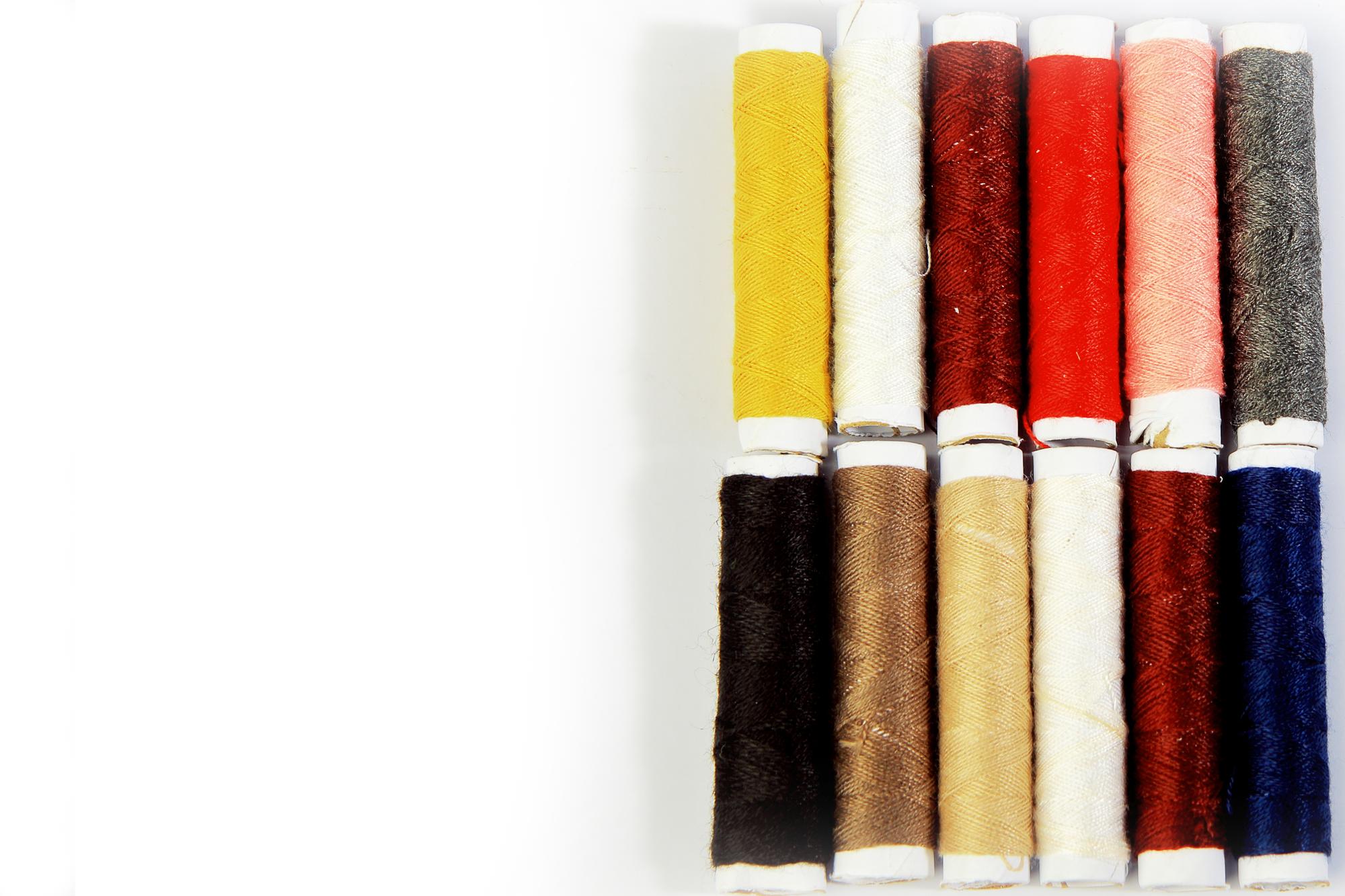 Stack of embroidered samples on table